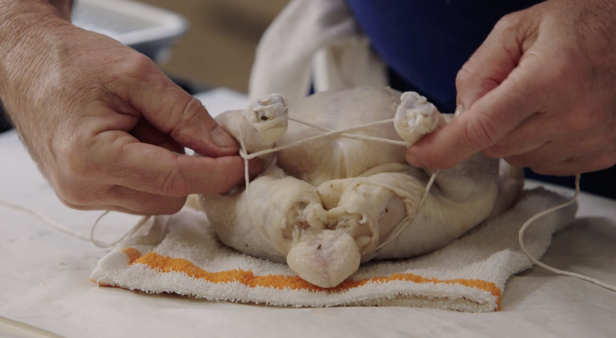 Thomas Keller trussing a chicken 3