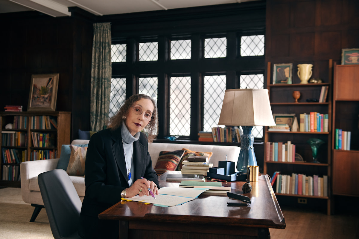 Joyce Carol Oates at desk