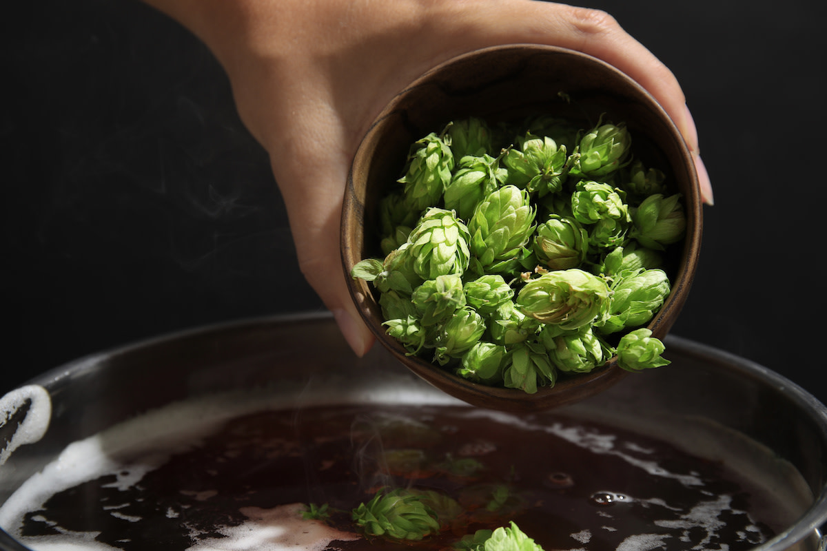 Brussel sprouts in bowl being poured into water