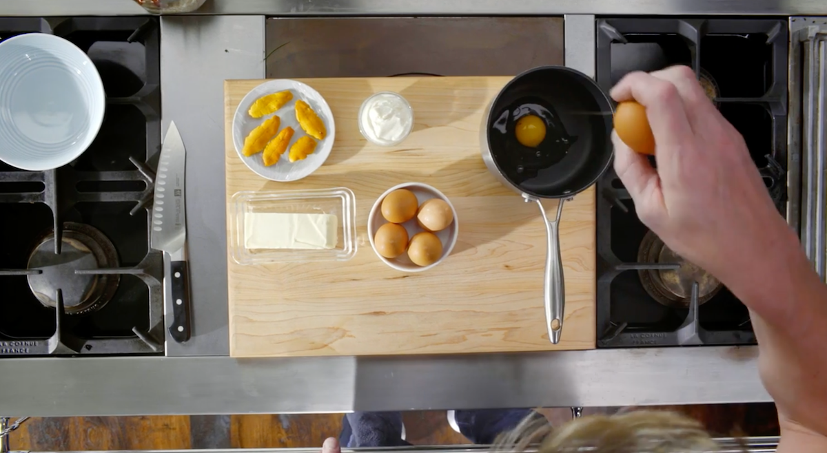 Gordon Ramsay cracking eggs into a pot