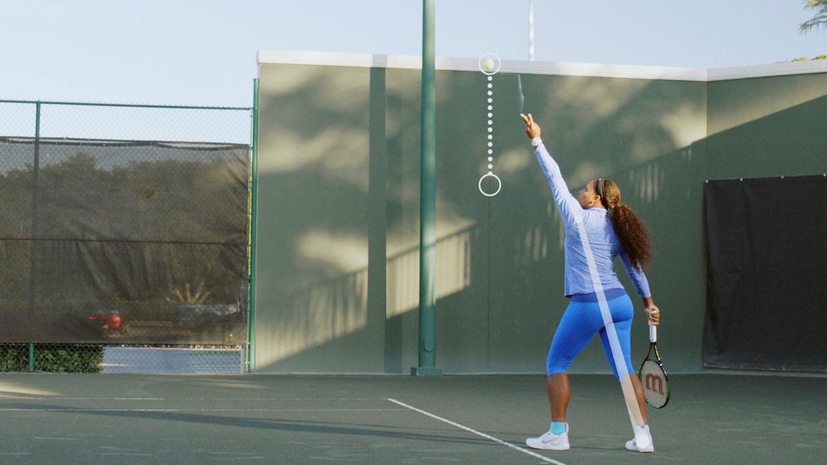 Serena Williams throwing tennis ball up before serve