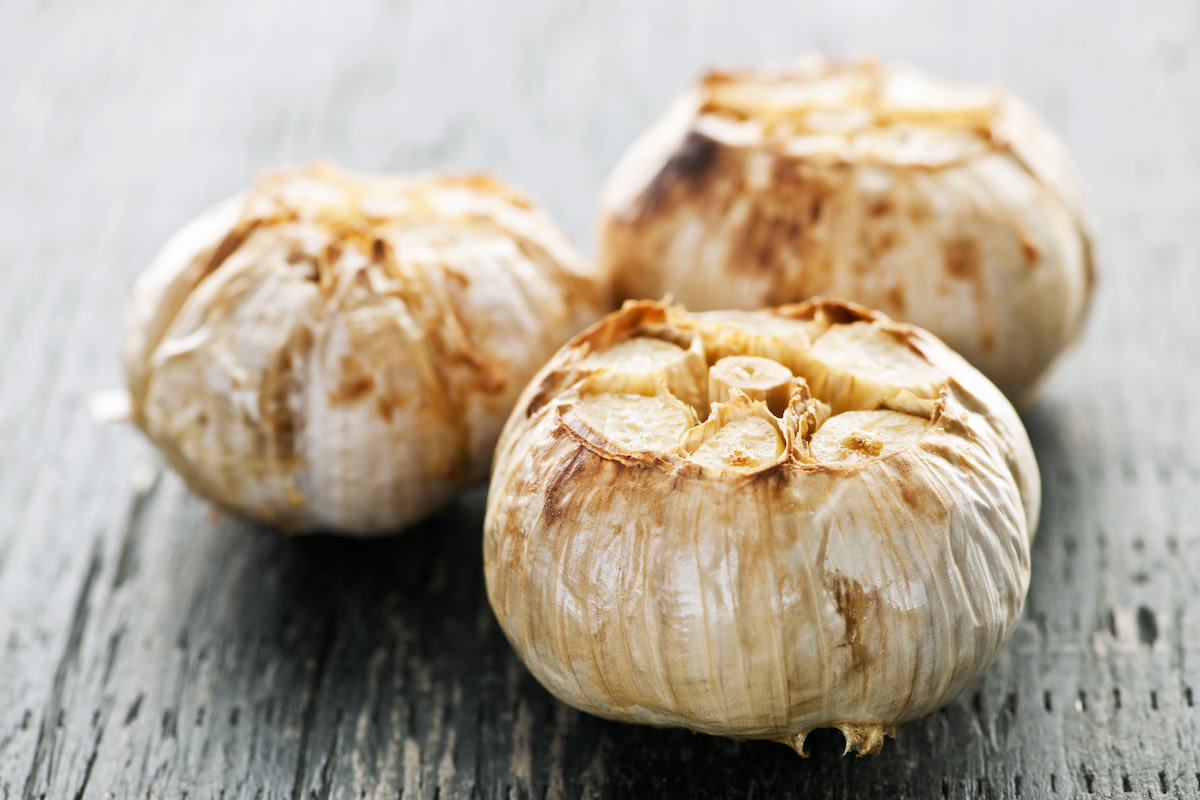 Roasted garlic on wood