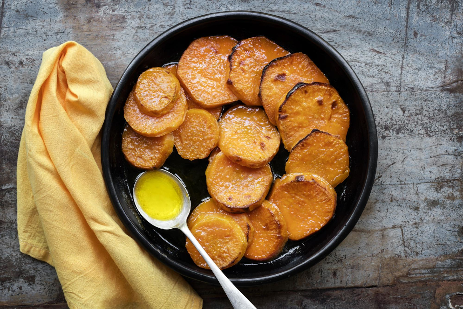 Sliced yams in an iron skillet