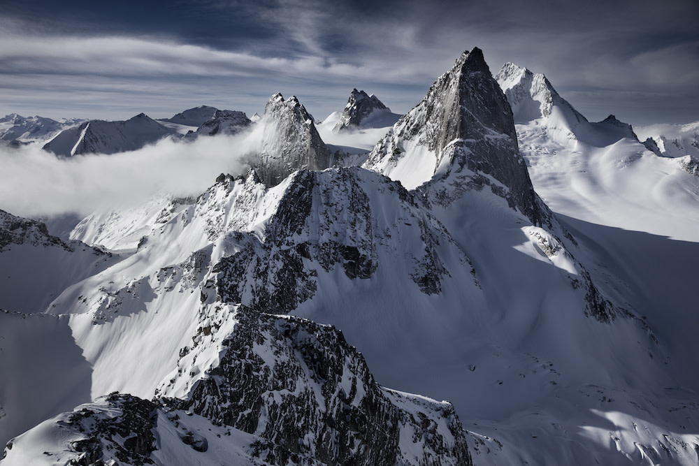 Jimmy Chin's photograph of a mountain range as an example of leading lines