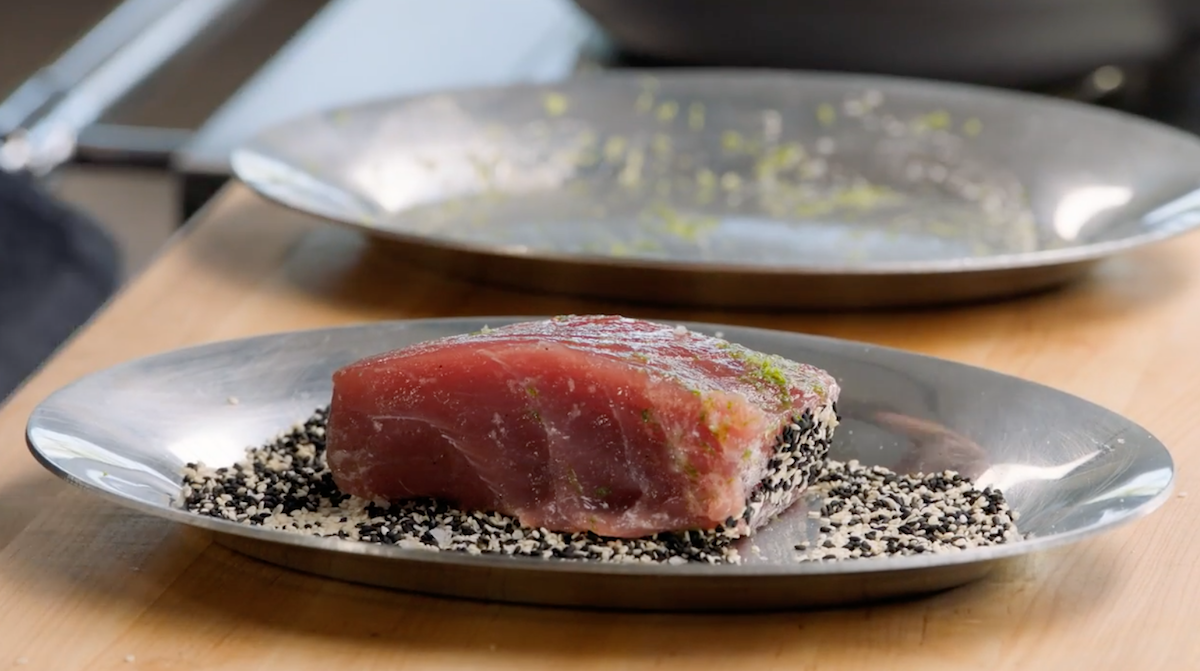 Tuna steak on plate with sesame seeds