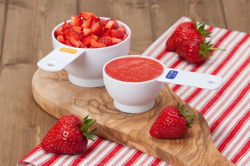 diced and pureed strawberries in measuring cups