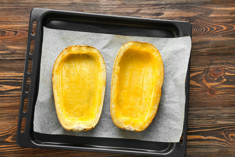 a spaghetti squash with olive oil before being roasted
