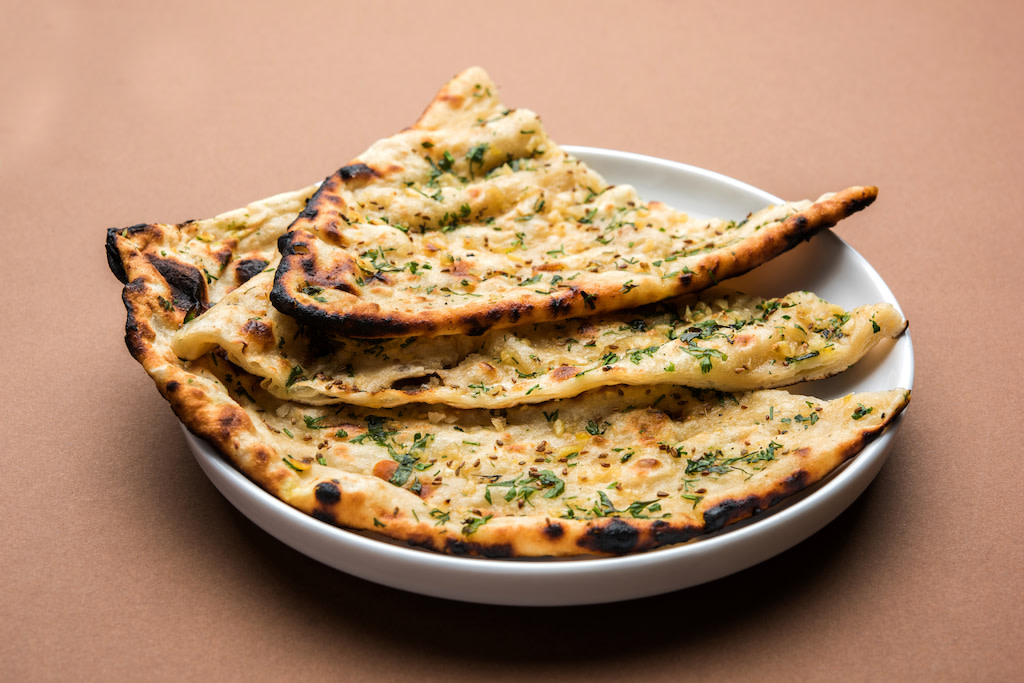 naan bread with herbs in bowl