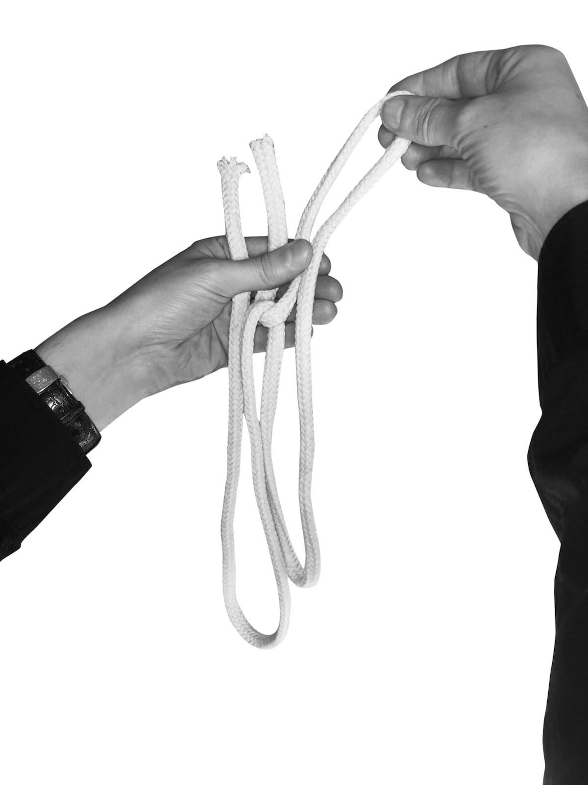 Person holding looped ropes with both hands