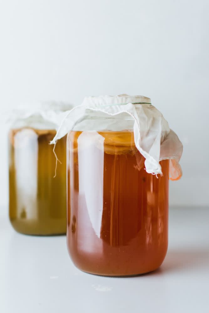 Kombucha in jars with cloth covering