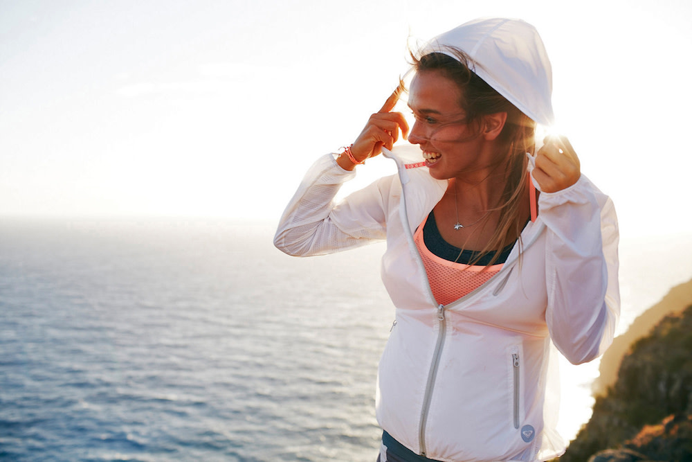 Jimmy Chin's photograph using natural light of a woman at the ocean