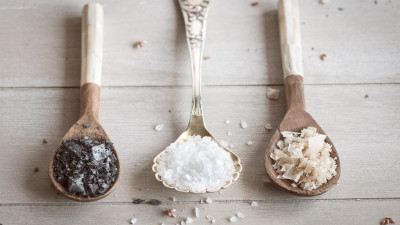 different types of salt in wooden spoons