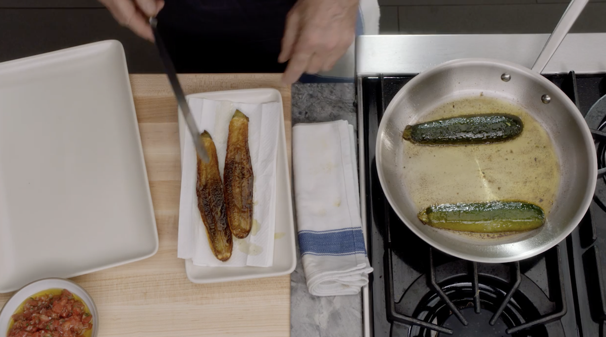 Thomas Keller transferring zucchini to paper towels from pan