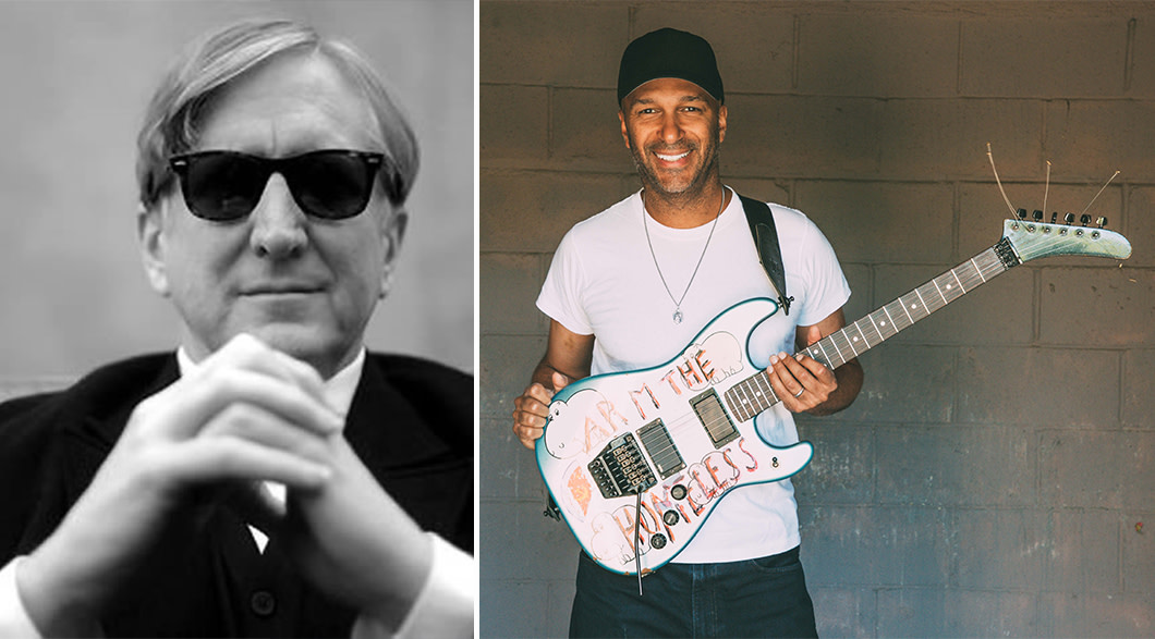 T Bone Burnett sits in a white shirt and black jacket with his hands steppled in front of him wearing black sunglasses. In a side-by-side photo, Tom Morello stands in a baseball cap and white t-shirt with the words "arm the homeless" written in red across a guitar that is strapped across his shoulders.  
