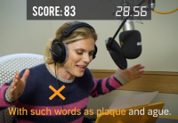 Emilia Fox sits at the microphone excitedly narrating Audible UK's Tongue Twister Challenge.