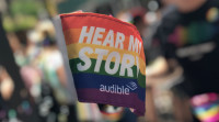 The Audible Pride flag is raised proudly at the World Pride March in NYC.