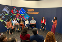 Mikaela Pasa pitches her team’s winning project to judges Leo Neumann, Chico Felitti, Paula Scarpin, Bianca Comparato and MM Izidoro, as Audible’s country manager for Brazil Adriana Alcântara looks on.