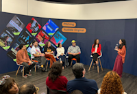 Mikaela Pasa pitches her team’s winning project to judges Leo Neumann, Chico Felitti, Paula Scarpin, Bianca Comparato and MM Izidoro, as Audible’s country manager for Brazil Adriana Alcântara looks on.