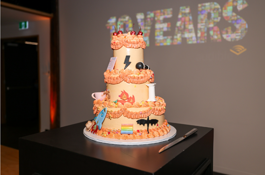 A three-tiered orange cake from Audible's celebration of 10 years of service for Australia.