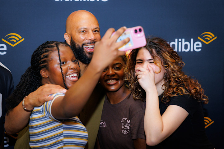 Interns in Audible’s Future Leaders program pose for a selfie with Common at the start of Global Impact Week.