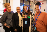 Members of Audible's Black Employee Network gather together smiling.