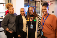 Members of Audible's Black Employee Network gather together smiling.