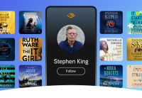 A phone screen sits center image. On it is Audible's orange chevron logo above a picture of Stephen King wearing a blue polo shirt and glasses with his name underneath. Below that is a button that says Follow on it. All around the phone are audiobook covers shown against a blue background.