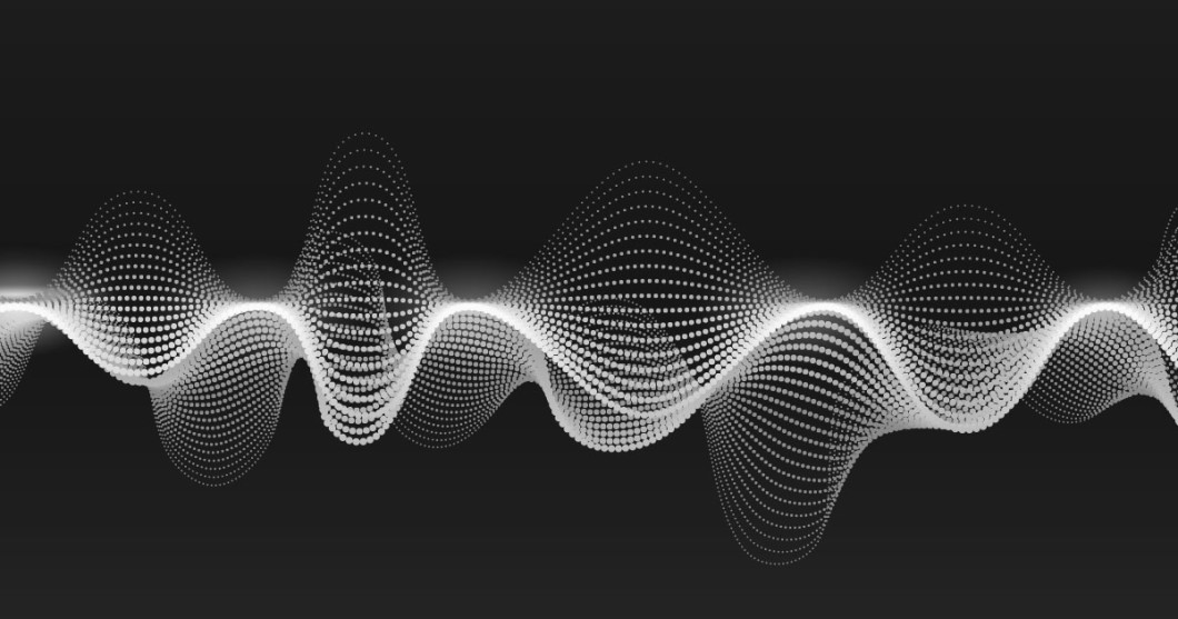 White audio soundwaves against a black background