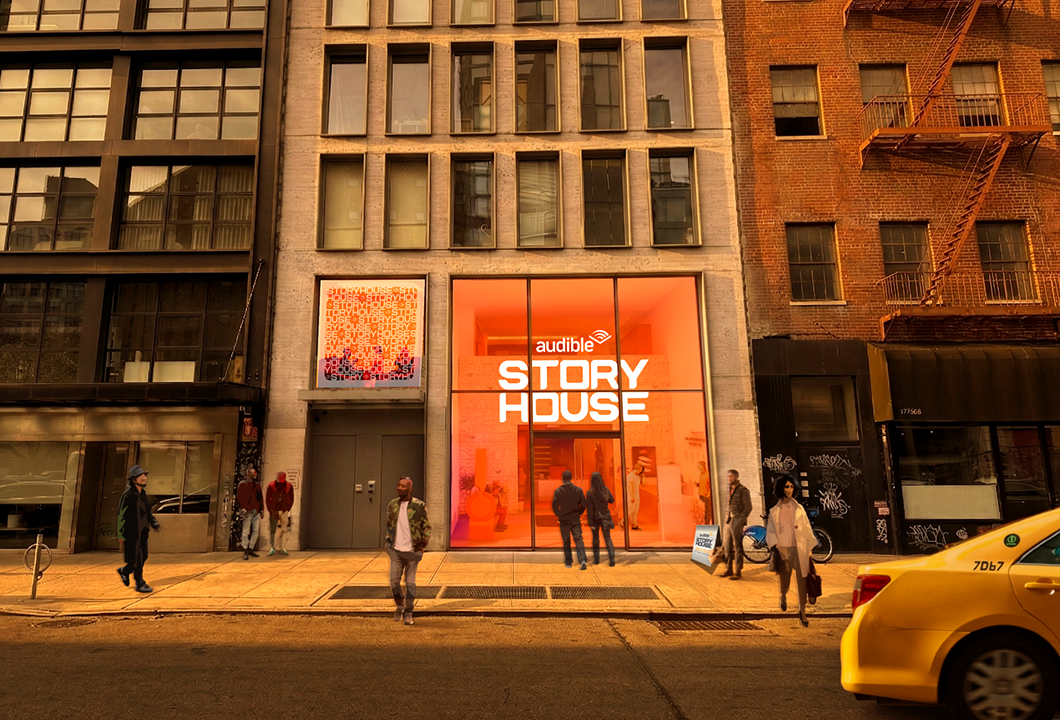 A rendering of the exterior of Audible Story House. The interior is partially visible behind a large, orange window.