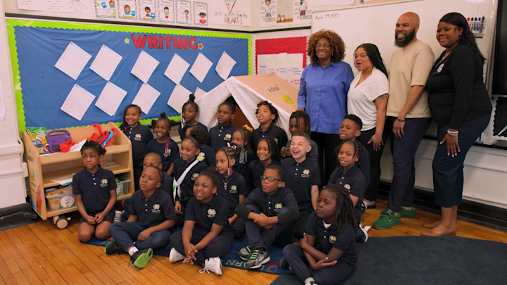 A photo of a classroom in Newark, NJ, posed next to an Audible Story Studio.