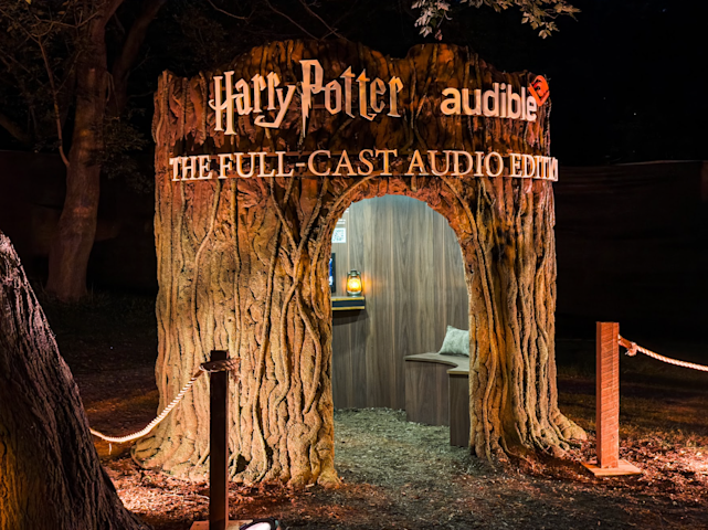 At the Harry Potter: Forbidden Forest Experience, glowing listening nooks inside hollowed-out trees let fans sink into the magic of the new audio editions.