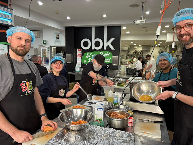 In Australia, Audible employees help prep meals for people in need at Our Big Kitchen. 