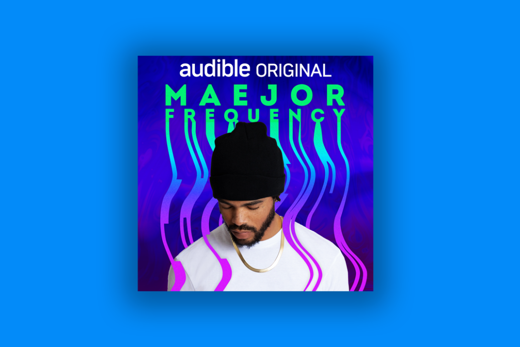 The book cover, featuring Maejor looking down and frequency waves around him, is placed on a blue background.