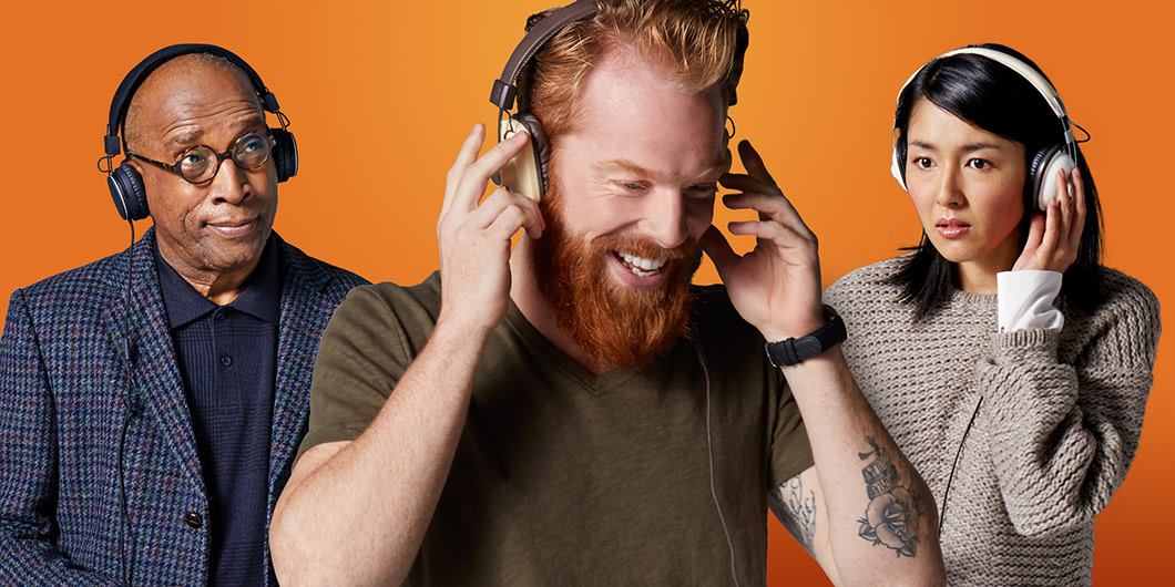 Three listeners with headphones on enjoying Audible.