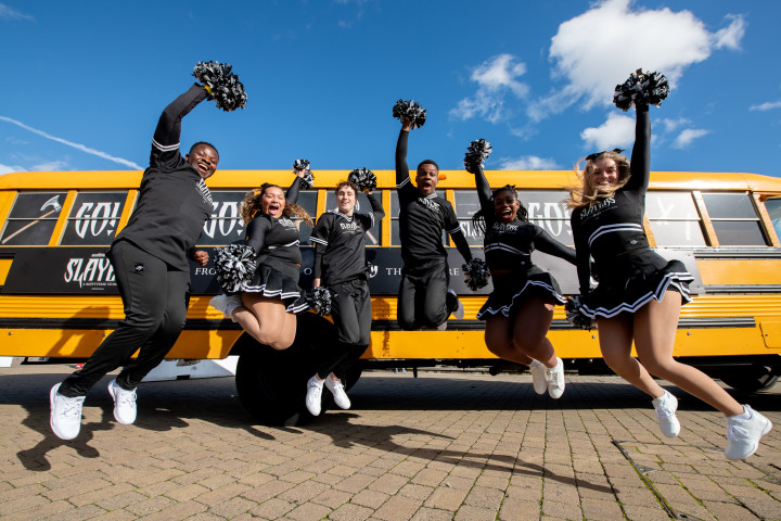 a group of cheerleaders posing for a photo