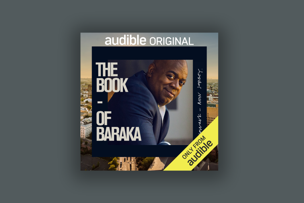 The cover art for "The Book of Baraka" featuring a smiling Ras J. Barka is centered on a dark grey background. 