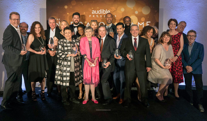 The Audible Narrator Hall of Fame honorees posing together in a large group with their awards in hand.