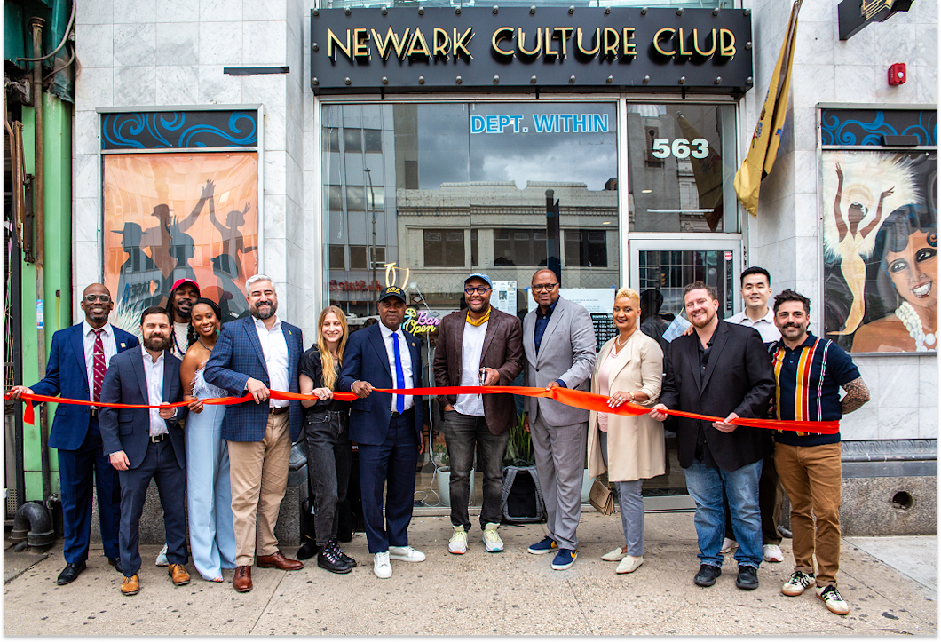 Local leaders, business owners, and Audible representatives at the ribbon-cutting for Newark Culture Club.