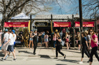 A large crowd of people in front of Audible's SXSW event