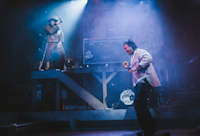 Brian Quijada and Nygel D. Robinson performing "Mexodus" onstage.