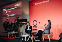 Audible's Chief Content Officer, Rachel Ghiazza, is seated onstage for her panel at Frankfurt Book Fair. On her left is Erin Cox of "Publishing Perspectives," who's moderating.
