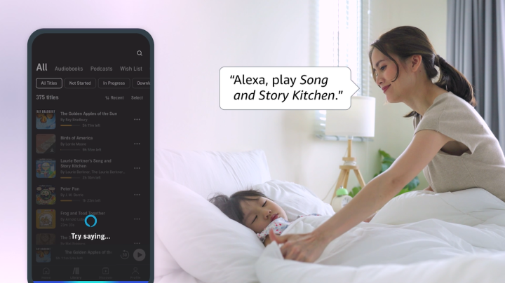 A close up of an iPhone overlaid of a photo of a woman who is saying "Alexa, play Song and Story Kitchen" as she plays with her child. 