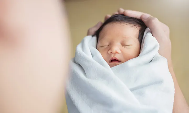 When to stop swaddling baby