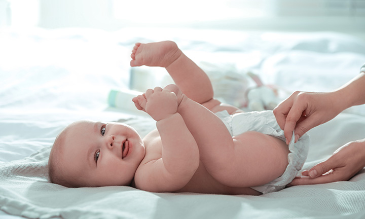 This is how I remember cloth diapers in my home when my kids were little!  Little tuft of diaper peeking out of the back of the rubber pants!