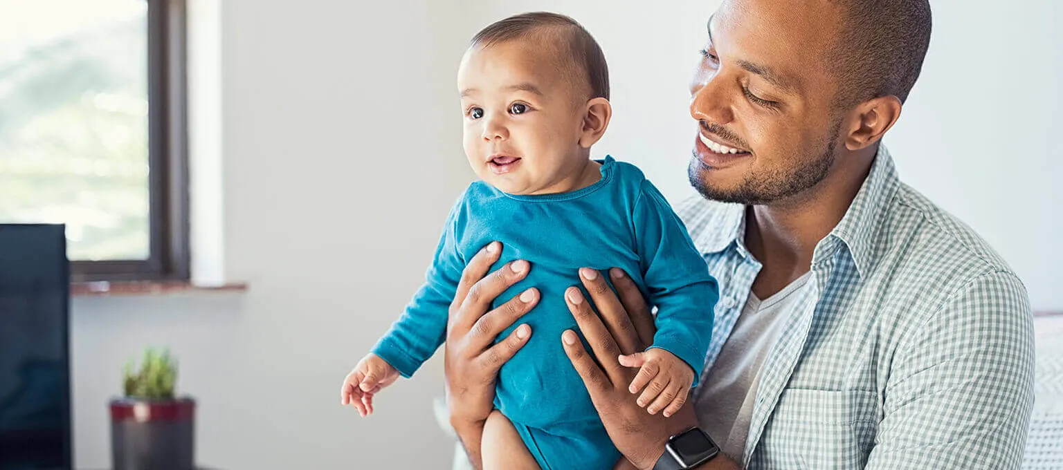 Dad working from home with baby