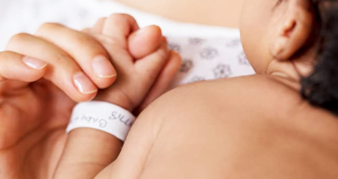 Pampers baby hand