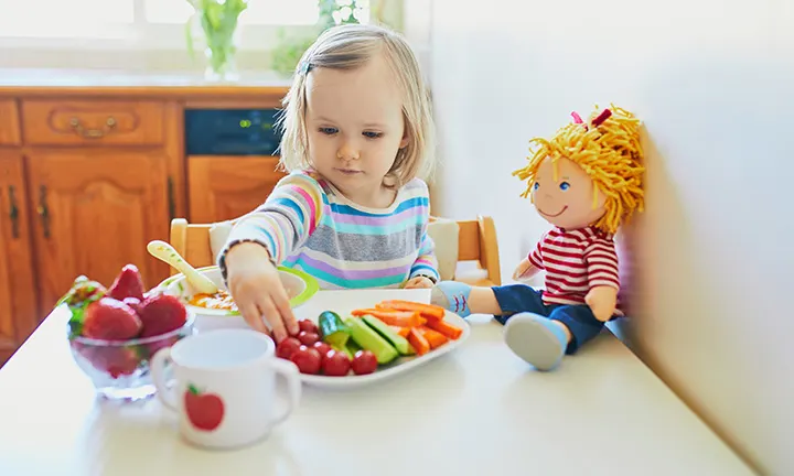 Toddler eating snack