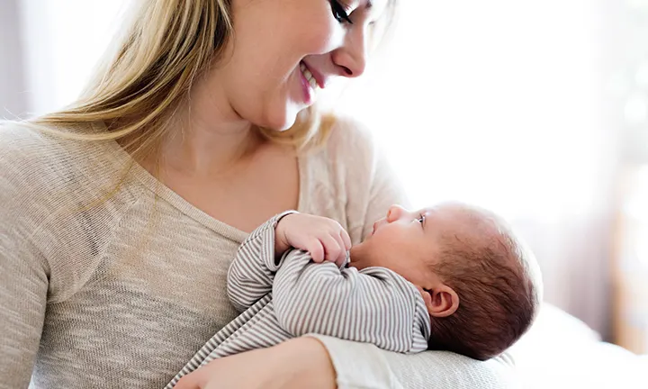 When do babies hold their head up