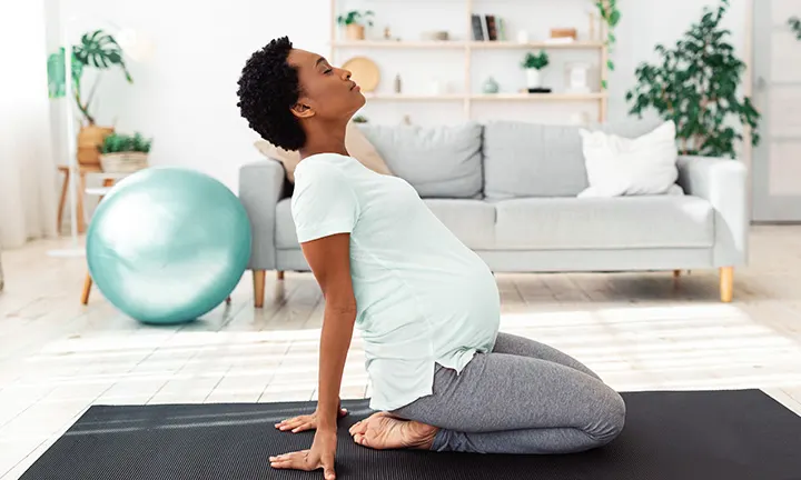 Pregnant woman stretching.