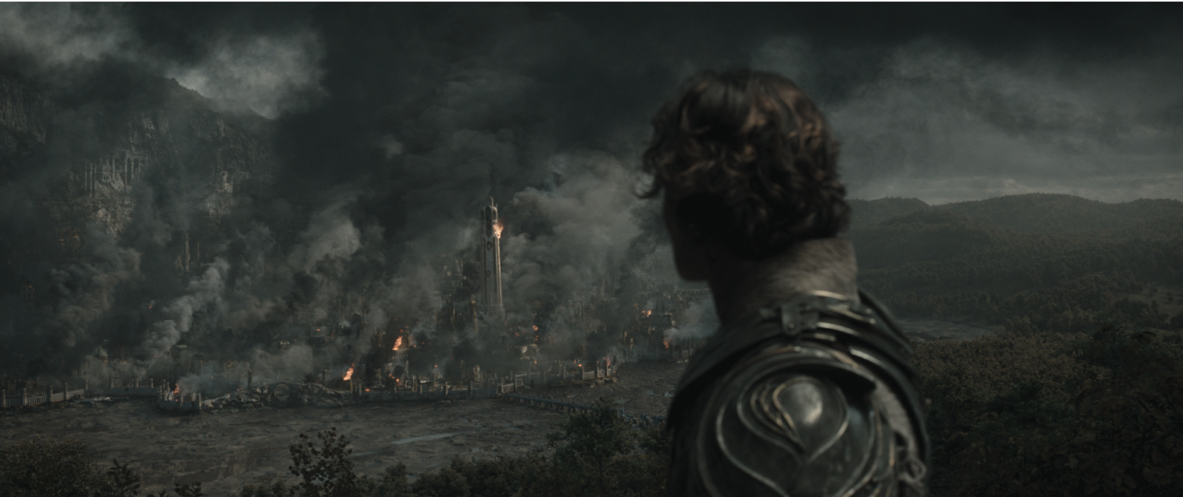 The Rings of Power Season 2 - Press Round-Up - Progression VFX Stills - Eregion destruction in the distance